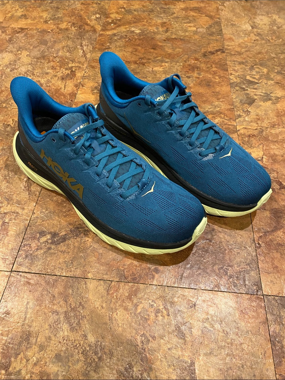 Hoka Profly Teal Blue Running Shoes with Light Yellow Soles